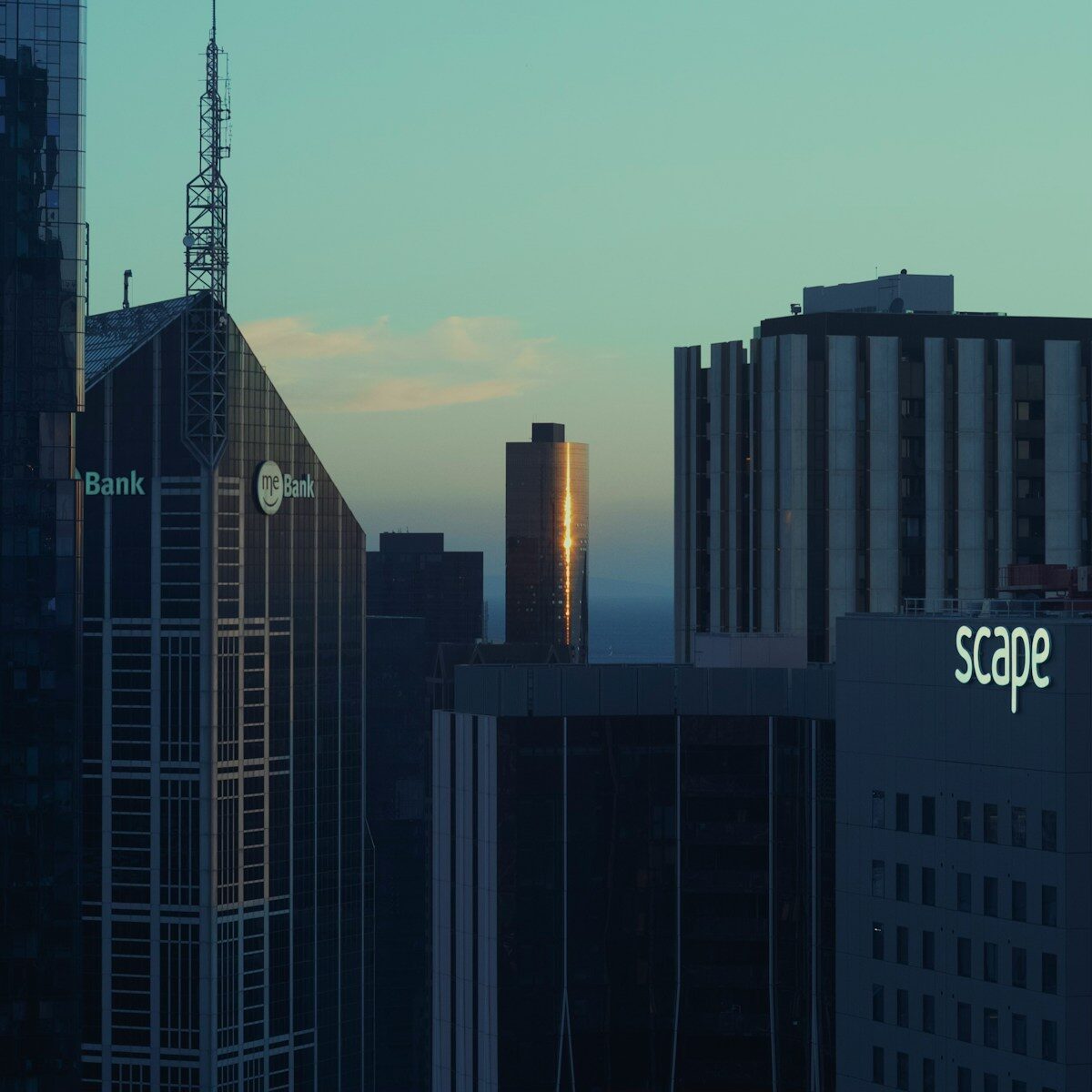 a city skyline with skyscrapers and a clock tower
